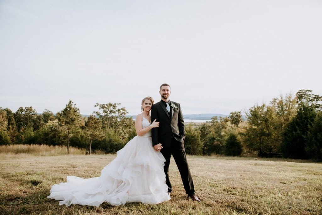 Bride and groom posing at Cabin Creek Lookout