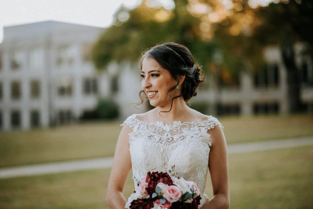 Bride looking to the side in front of UofA