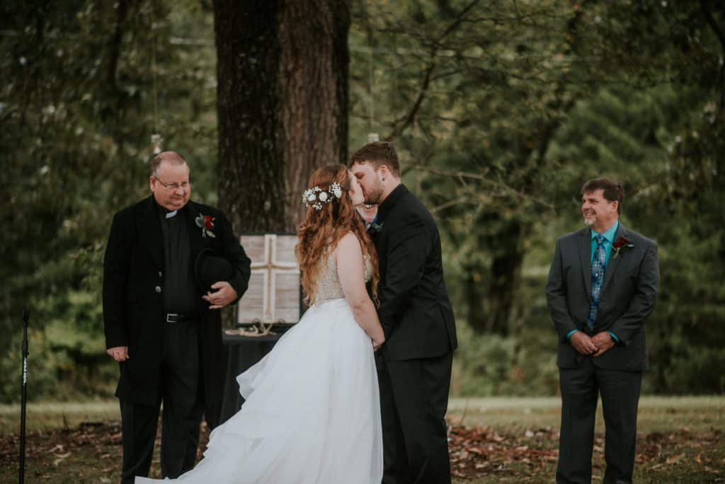 Bride and groom having their first kiss