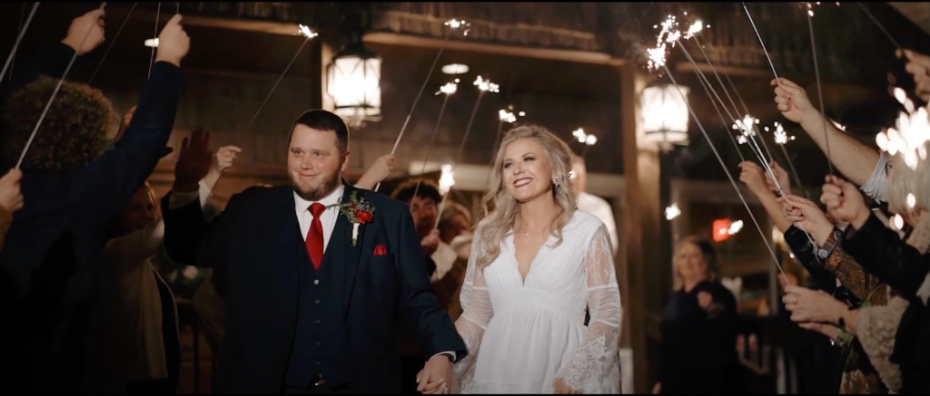 wedding photo of couple during their exit at st Anthony's on the creek