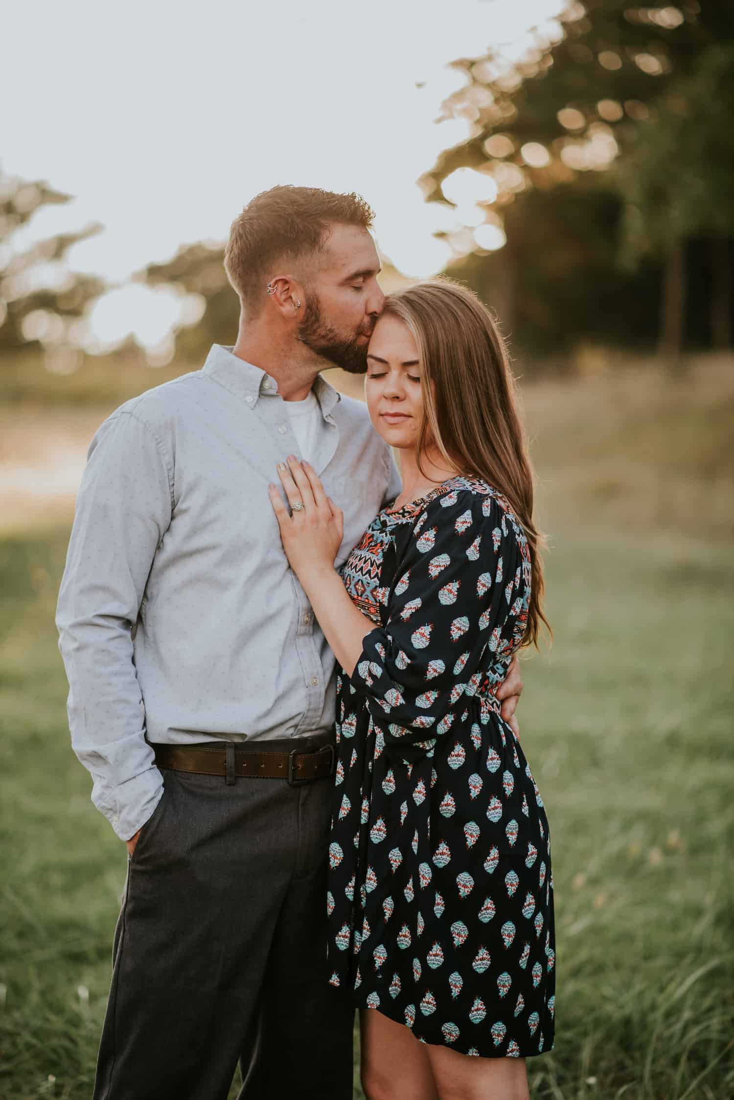 couple-kissing-engagement-session-sunset