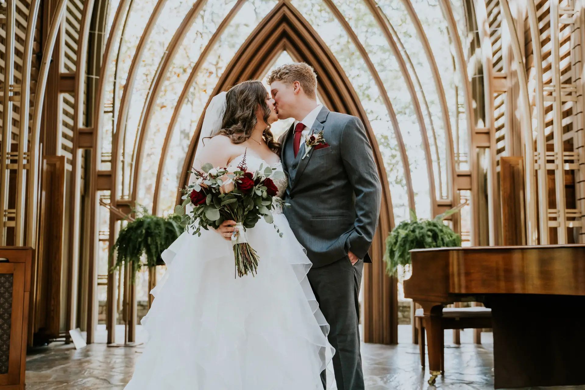 Couple at wedding ceremony in Cooper Chapel in Northwest Arkansas captured by Haziel Photo & Films