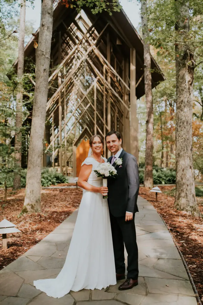 Wedding Content Creation 3 Bride and groom standing among tall trees, bride holding her bouquet