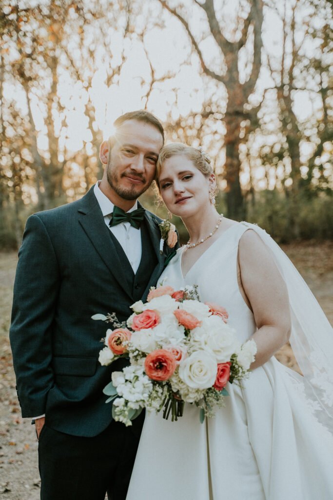 Bride and groom with bouquet after a small wedding at Stone Chapel at MattLane Farm, Fayetteville
