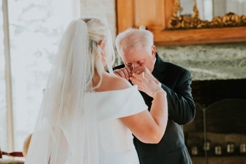 Bride and her father sharing an emotional moment before the ceremony