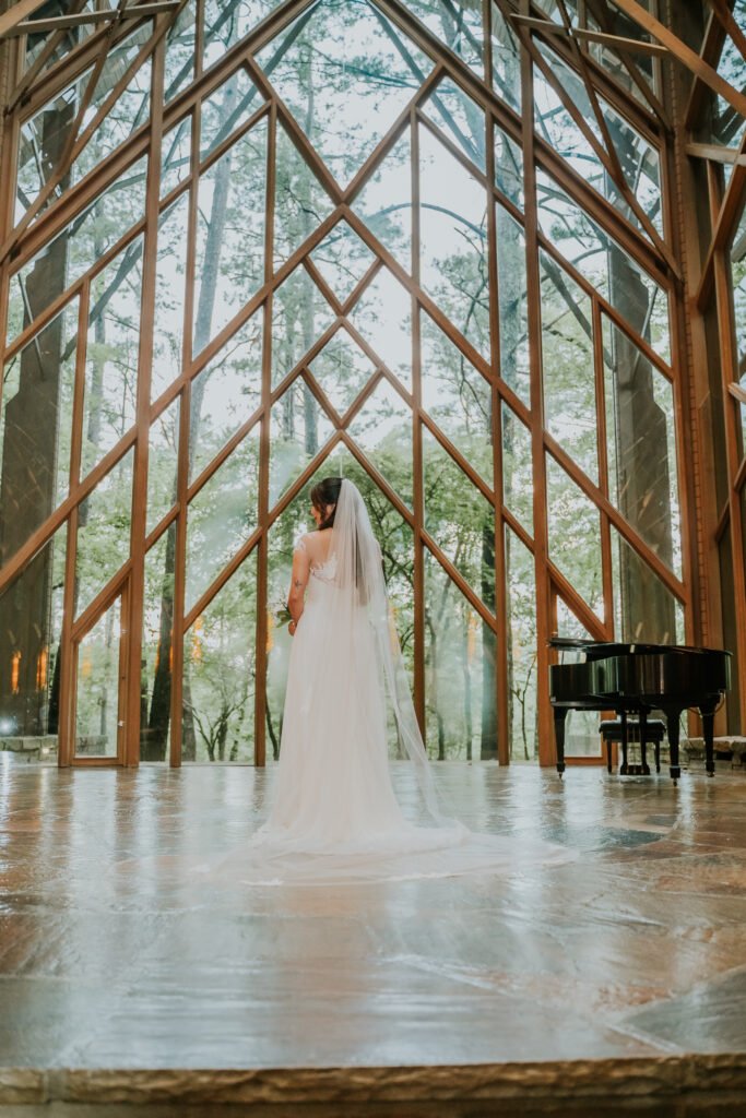 Bride walking down the aisle at Thorncrown Chapel in Eureka Springs, Arkansas