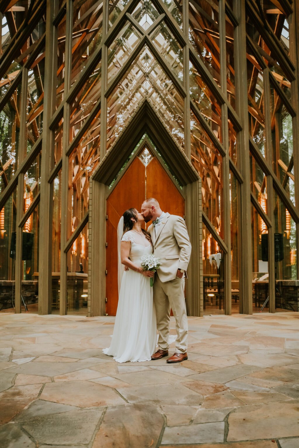 Couple at the doors of Anthony Chapel at Garvan Woodland Gardens in Hot Springs, Arkansas