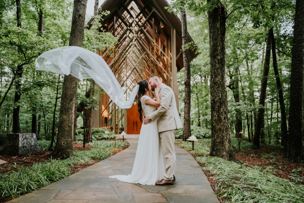 Bride's veil catching the wind outside Thorncrown Chapel in Eureka Springs, Arkansas