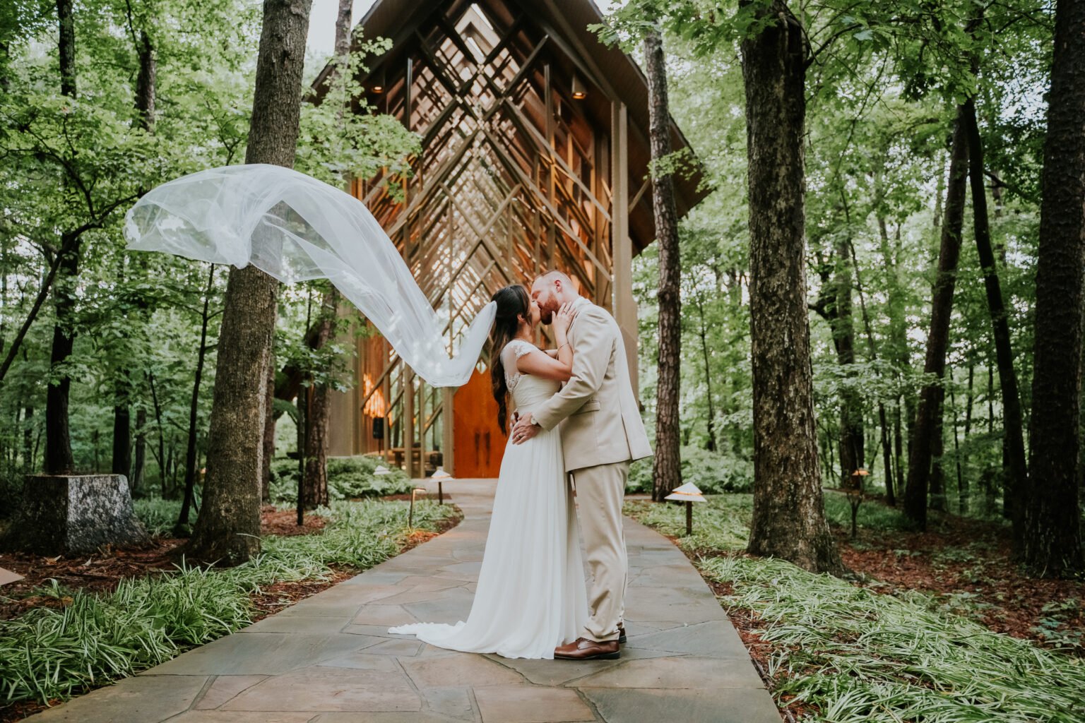 Bride and groom outside Anthony Chapel in the woods at Garvan Woodland Gardens