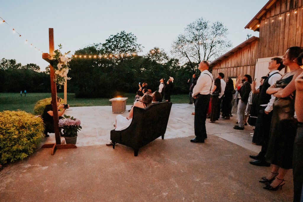 String lights and evening seating outside the barn at Holland Barn