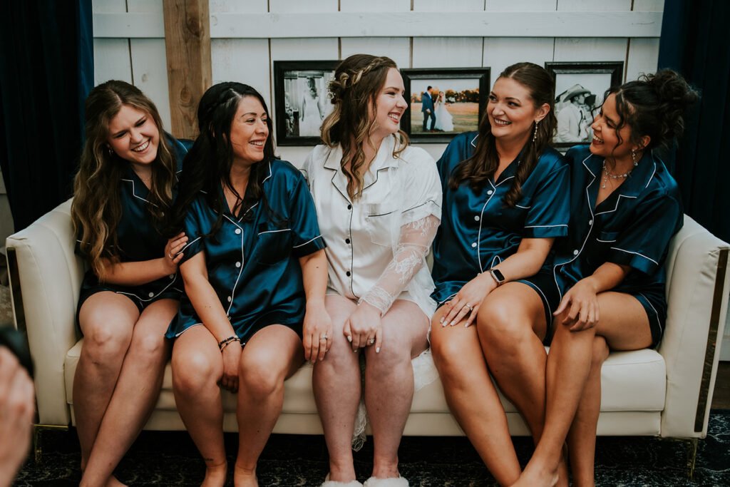 Bride and her bridesmaids in the bridal room at Holland Barn in Highfill, Arkansas