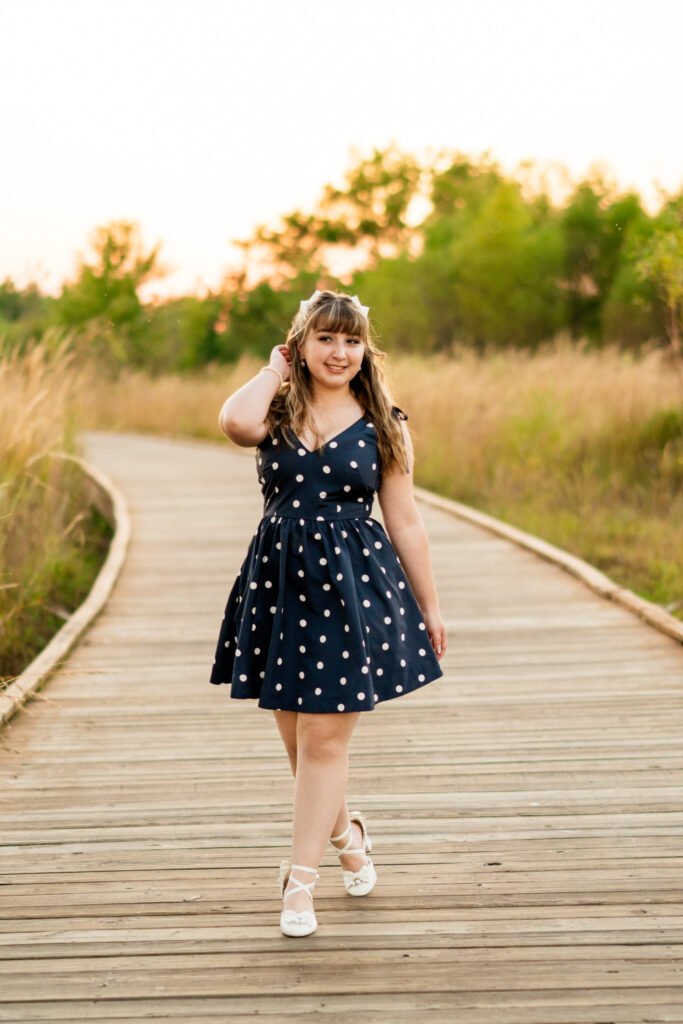Senior walking the boardwalk at Osage Park at golden hour