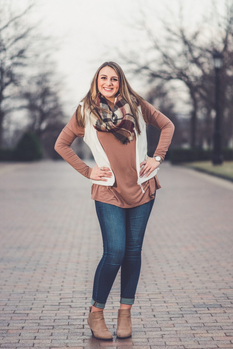 Senior girl in a scarf and jeans on a tree-lined walkway in winter, NWA senior pictures