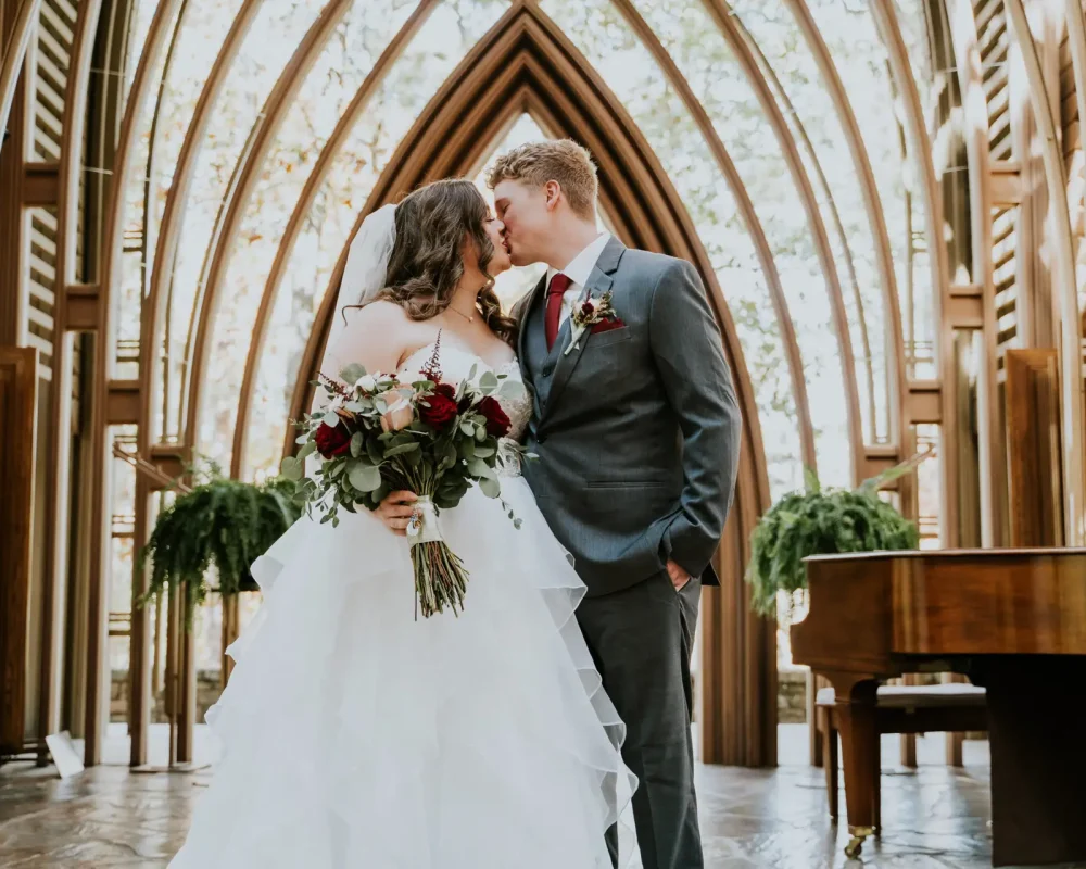 Couple at wedding ceremony in Cooper Chapel in Northwest Arkansas captured by Haziel Photo & Films