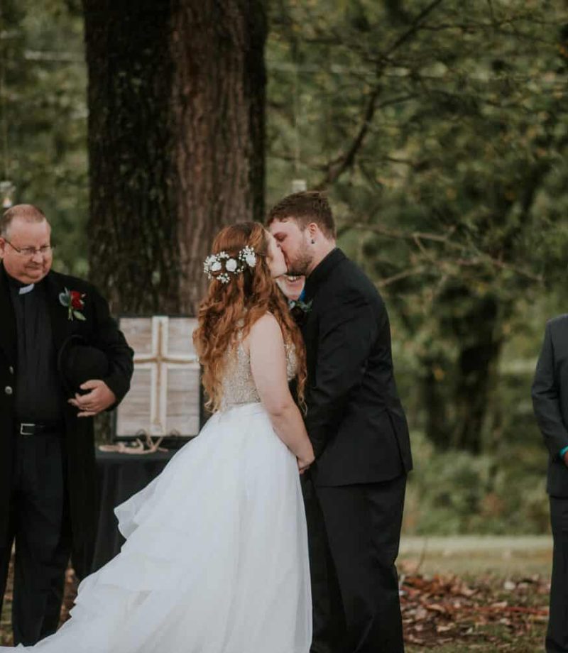 Bride and groom having their first kiss