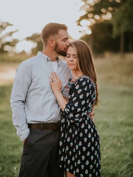 couple-kissing-engagement-session-sunset