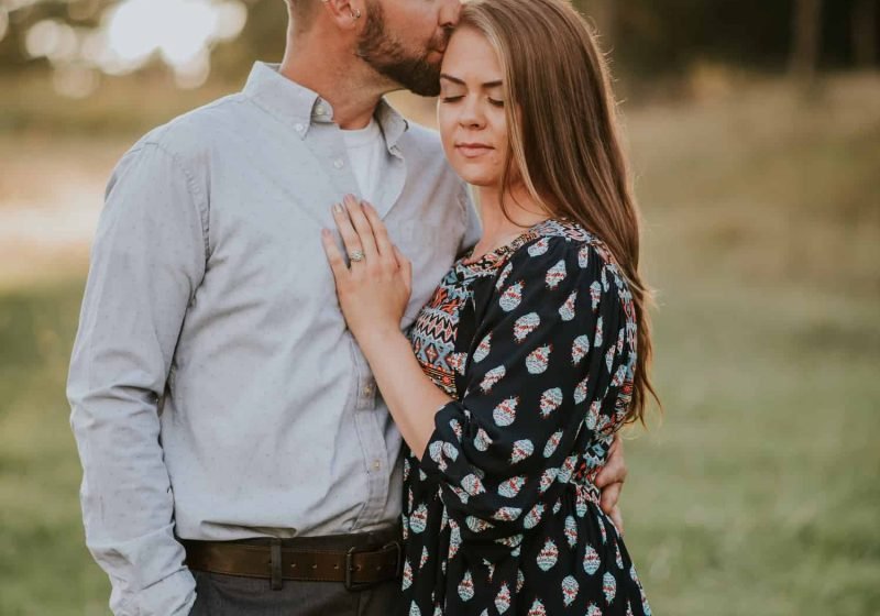 couple-kissing-engagement-session-sunset